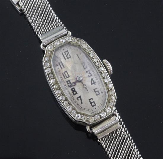 A ladys 1920s 18ct white gold and diamond Rolex manual wind cocktail watch,
